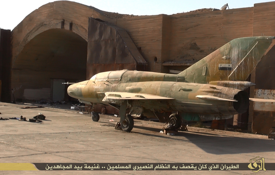 Abandoned MIg war planes inside the Taquba Airbase after it was over run by ISIL in 2014.
